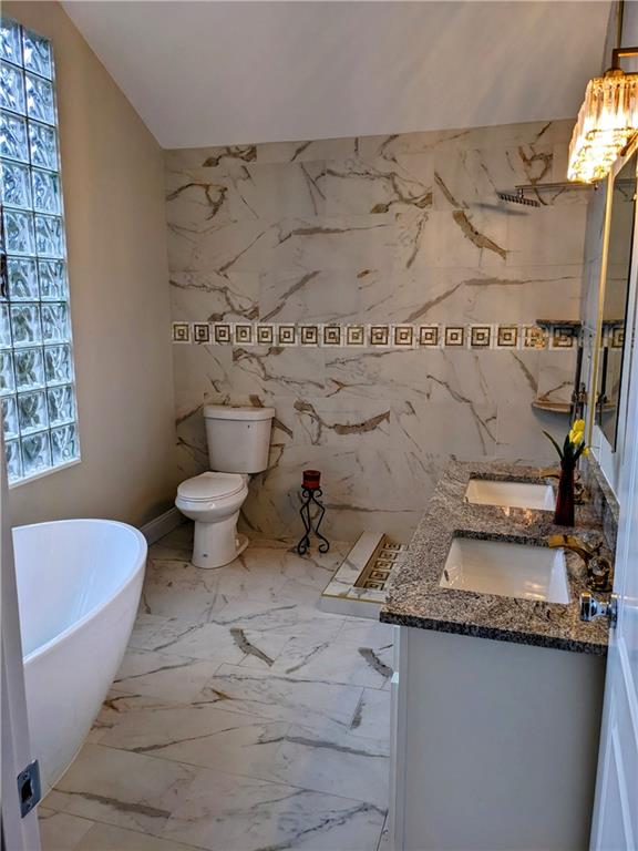 432 Raspberry Drive Monroeville, PA 15146 - Photo 20 of 39 a bathroom with a granite countertop toilet and a sink
