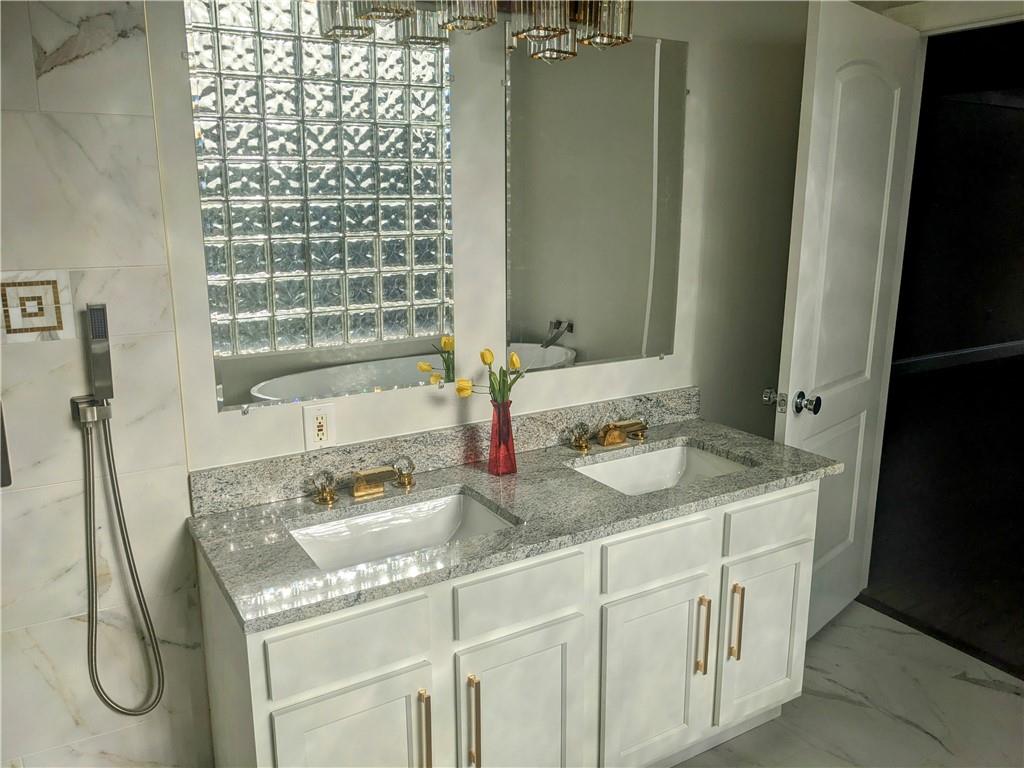 432 Raspberry Drive Monroeville, PA 15146 - Photo 21 of 39 a bathroom with a granite countertop sink and a mirror