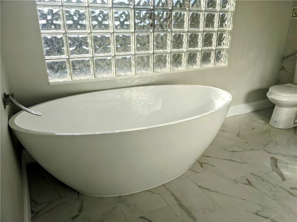 432 Raspberry Drive Monroeville, PA 15146 - Photo 22 of 39 a view of a bathtub in a bathroom