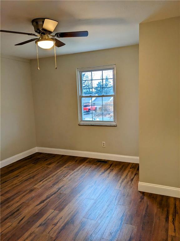 432 Raspberry Drive Monroeville, PA 15146 - Photo 25 of 39 a view of an empty room with wooden floor and a window