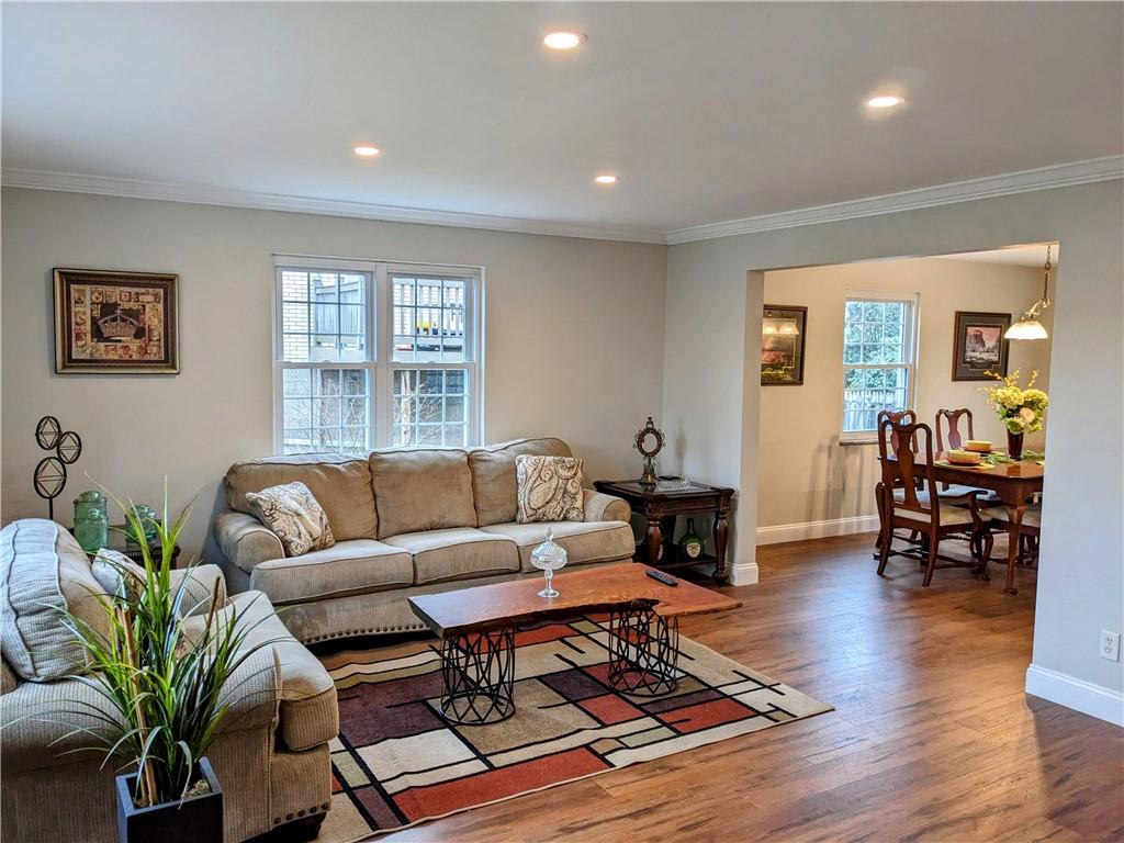 432 Raspberry Drive Monroeville, PA 15146 - Photo 7 of 39 a living room with furniture a wooden floor and a large window