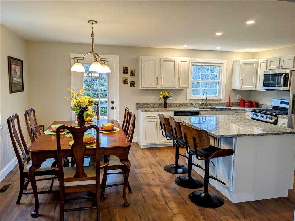 432 Raspberry Drive Monroeville, PA 15146 - Photo 9 of 39 a view of a dining room with furniture window and wooden floor