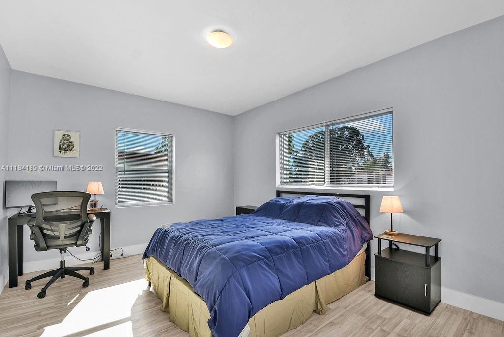 331 Northwest 144th Street Miami, FL 33168 - Photo 12 of 35 a bedroom with a bed and a window