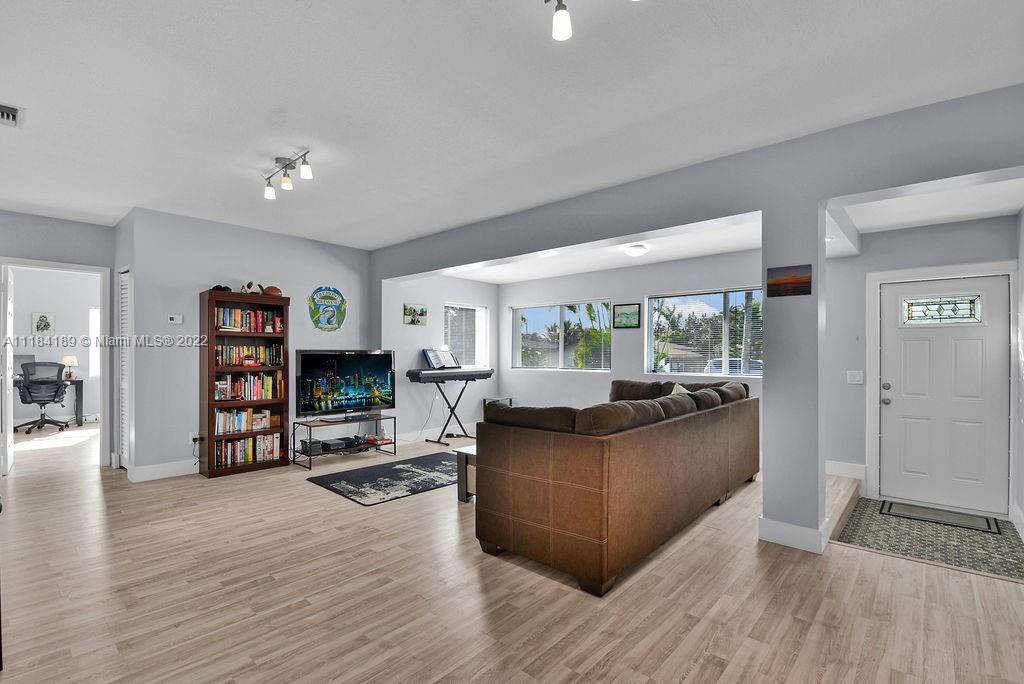 331 Northwest 144th Street Miami, FL 33168 - Photo 14 of 35 a living room with furniture and a wooden floor