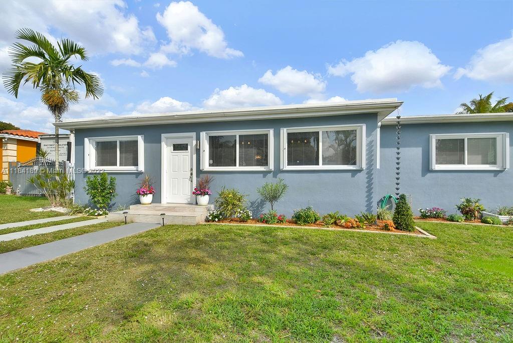 331 Northwest 144th Street Miami, FL 33168 - Photo 2 of 35 a front view of house with yard and green space