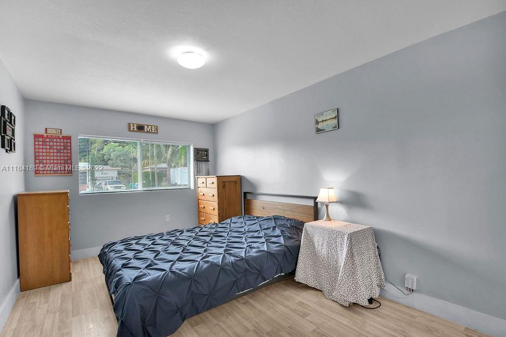 331 Northwest 144th Street Miami, FL 33168 - Photo 27 of 35 a bedroom with a bed and window