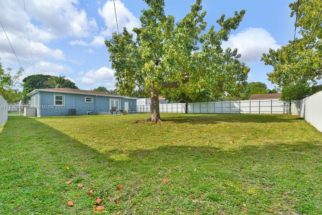 331 Northwest 144th Street Miami, FL 33168 - Photo 31 of 35 a front view of a house with a yard