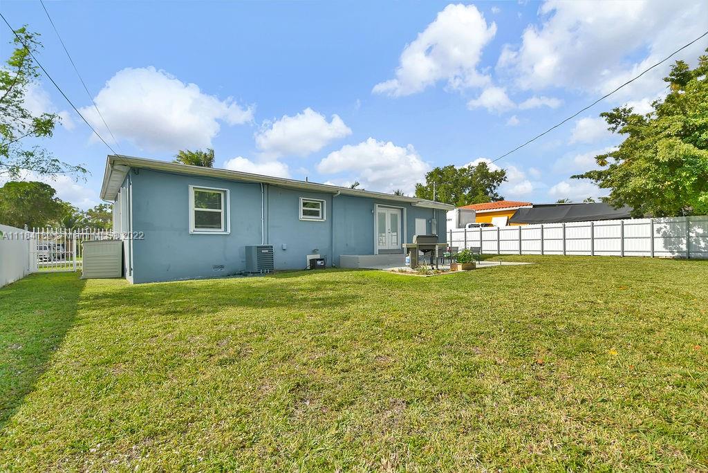 331 Northwest 144th Street Miami, FL 33168 - Photo 32 of 35 a view of a house with a backyard