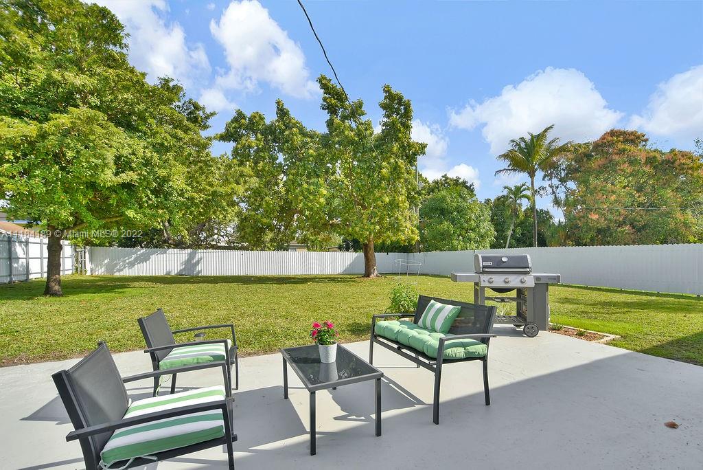 331 Northwest 144th Street Miami, FL 33168 - Photo 33 of 35 a view of a lake with couches and wooden floor