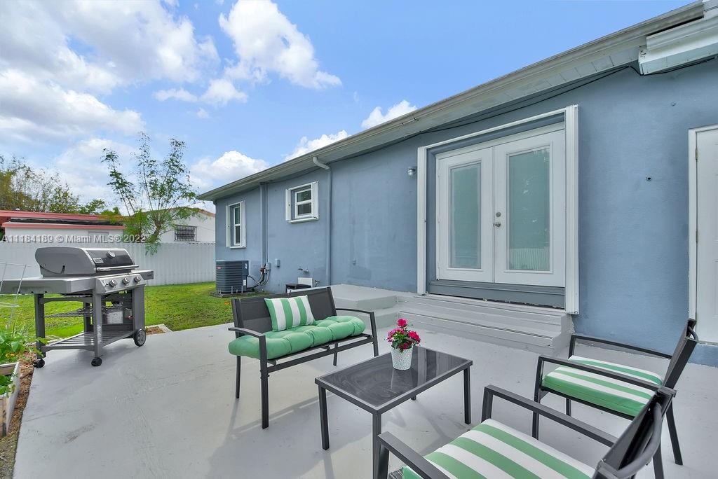 331 Northwest 144th Street Miami, FL 33168 - Photo 34 of 35 a view of two chairs in the patio