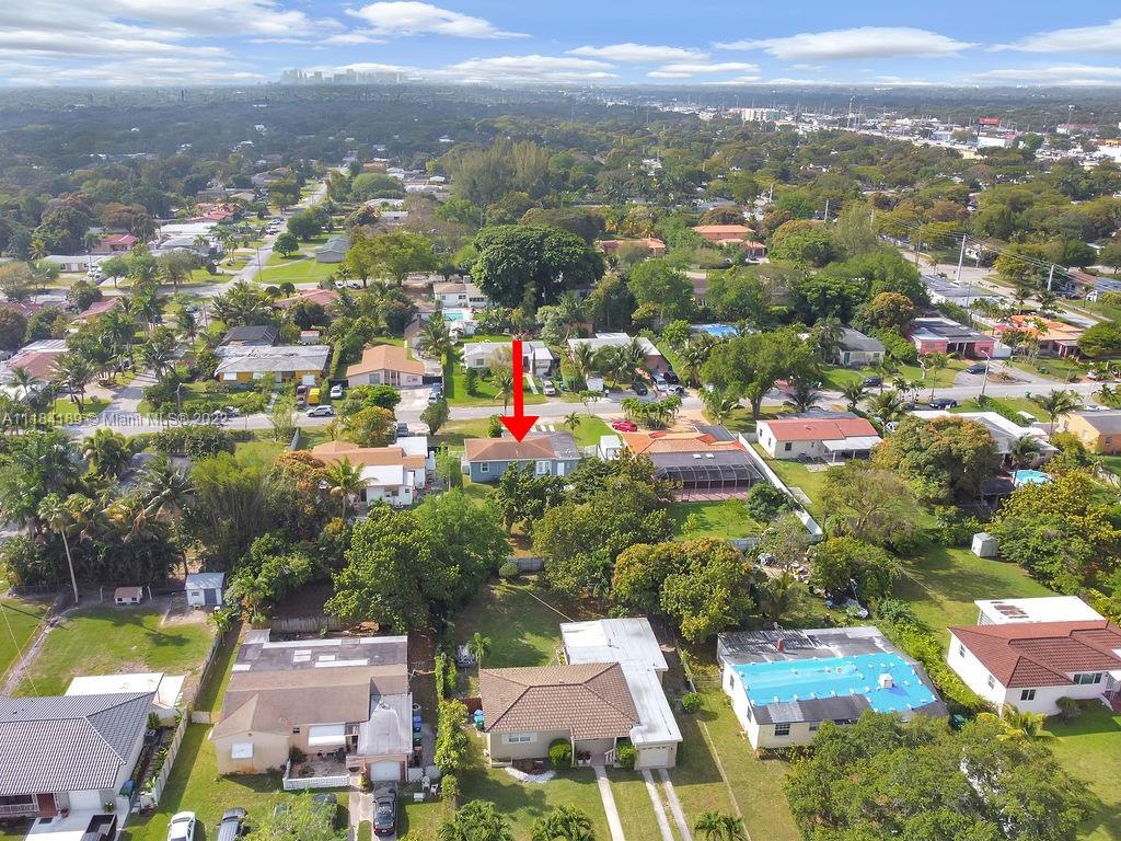 331 Northwest 144th Street Miami, FL 33168 - Photo 6 of 35 an aerial view of residential houses with outdoor space and swimming pool