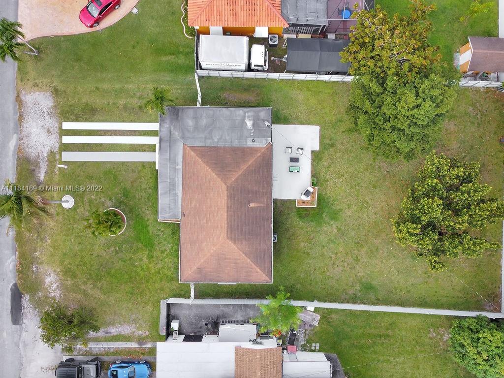 331 Northwest 144th Street Miami, FL 33168 - Photo 8 of 35 an aerial view of a house with a yard