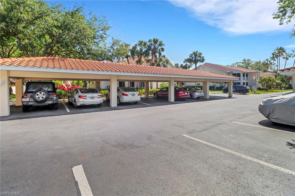 110 Siena Way, Unit 206 Naples, FL 34119 - Photo 27 of 35 a view of street with parked cars
