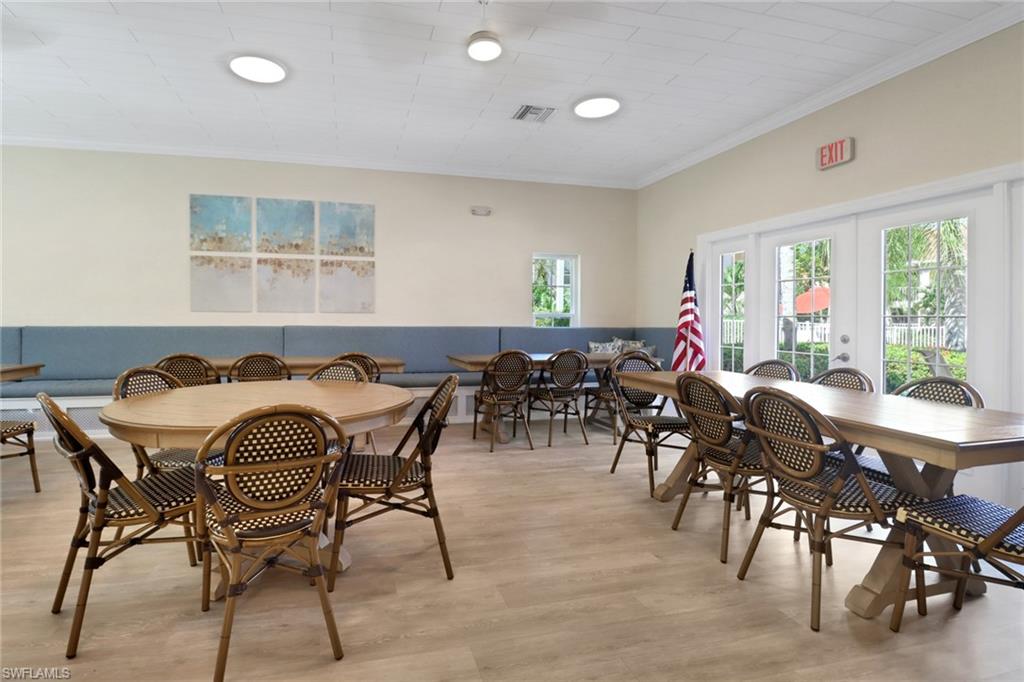 110 Siena Way, Unit 206 Naples, FL 34119 - Photo 29 of 35 a view of a dining room with furniture window and outside view
