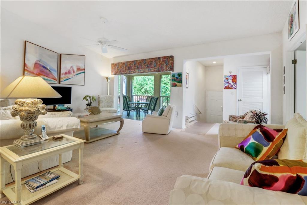 110 Siena Way, Unit 206 Naples, FL 34119 - Photo 4 of 35 a living room with furniture and a couch