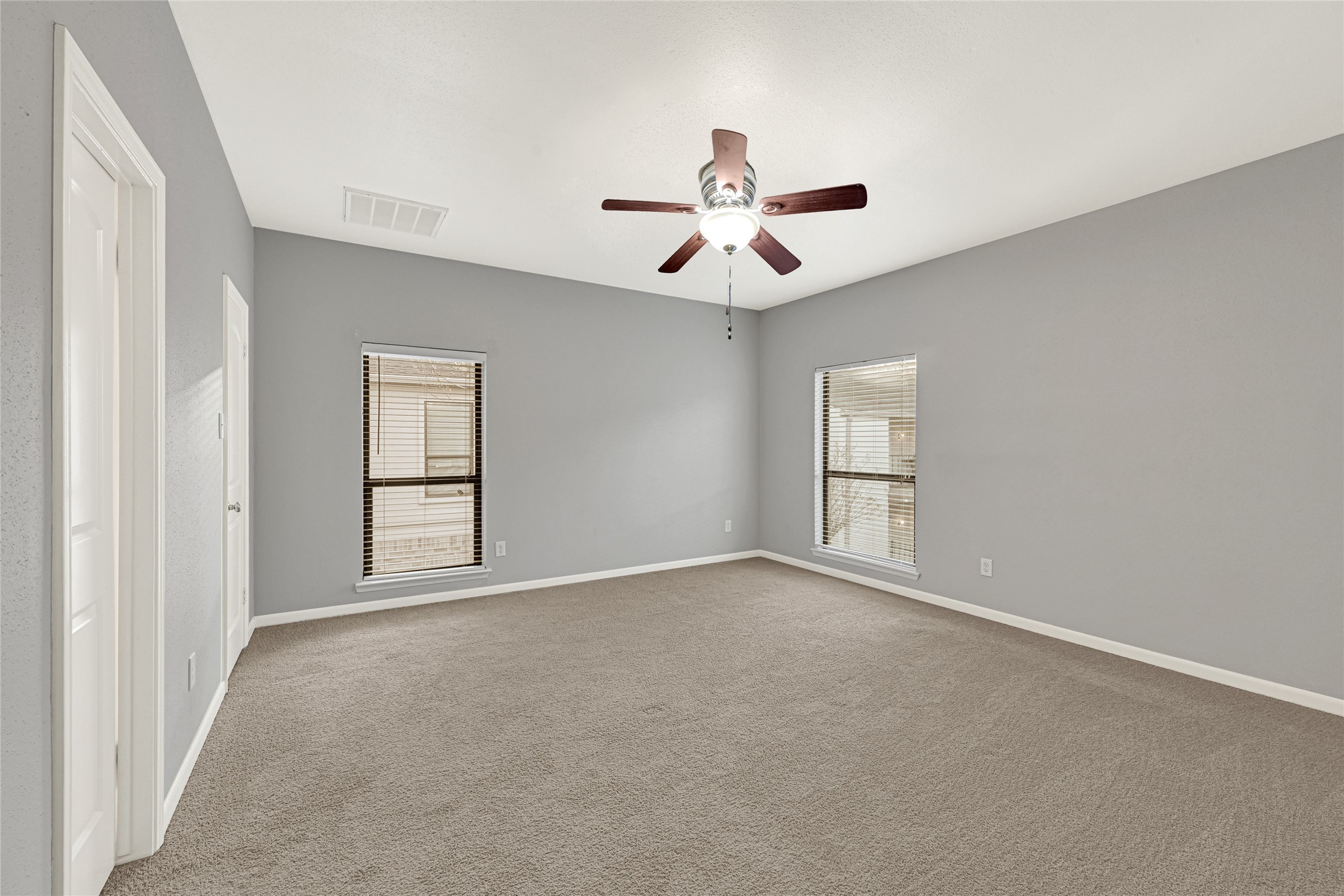 2425 Augusta Drive, Unit 29 Houston, TX 77057 - Photo 19 of 30 a view of an empty room with a window