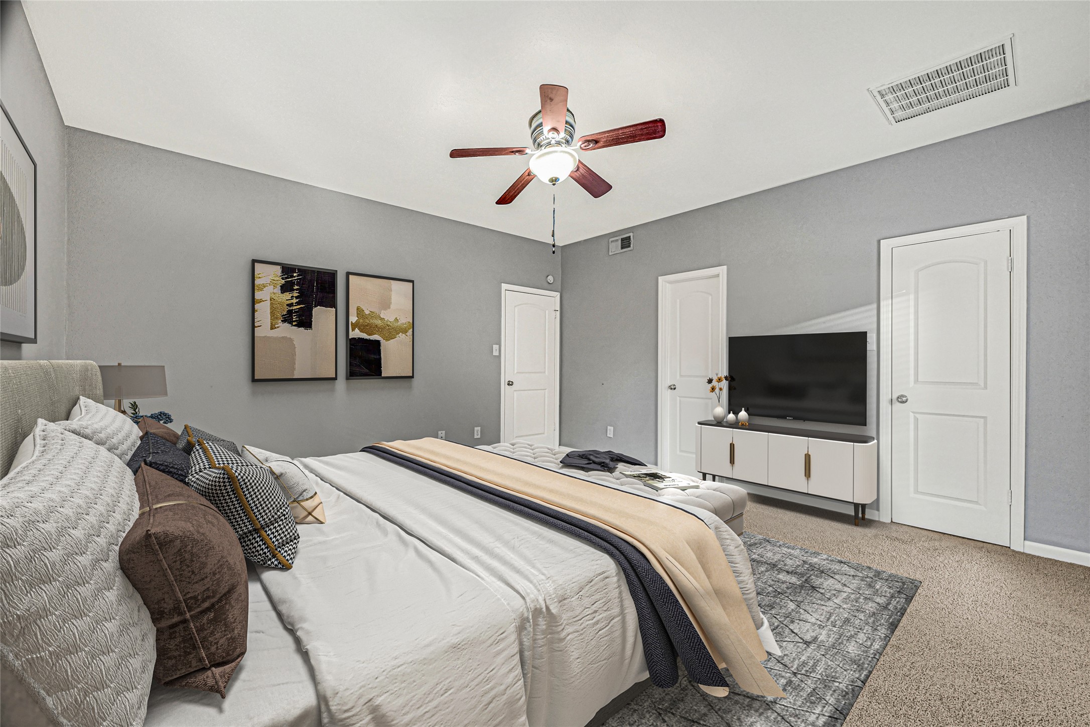 2425 Augusta Drive, Unit 29 Houston, TX 77057 - Photo 20 of 30 a bedroom with a bed and a flat screen tv