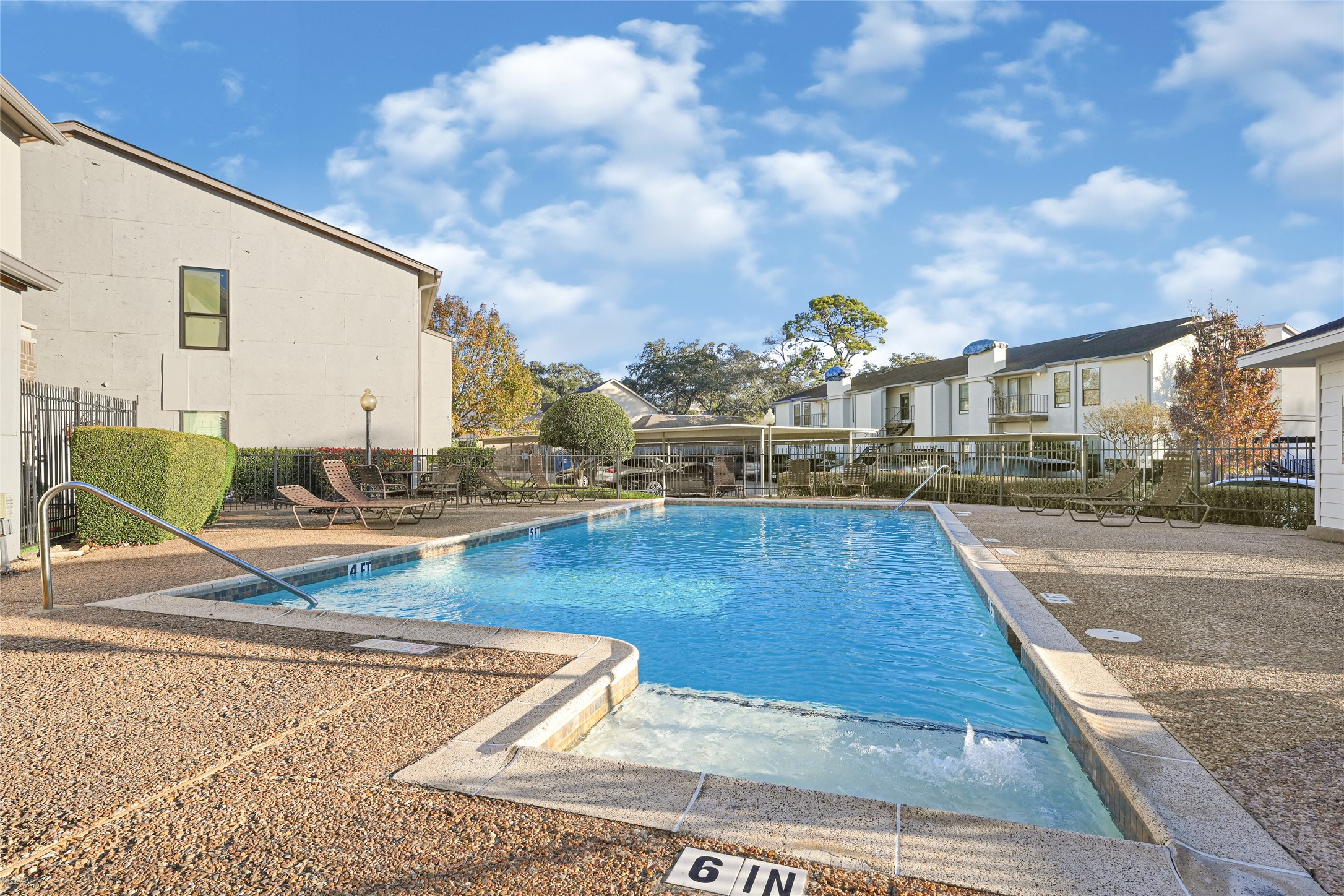 2425 Augusta Drive, Unit 29 Houston, TX 77057 - Photo 22 of 23 a view of a swimming pool with a lounge chairs