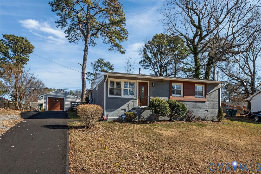 2815 Caniff Road Richmond, VA 23223 - Photo 1 of 39 a front view of a house with garden