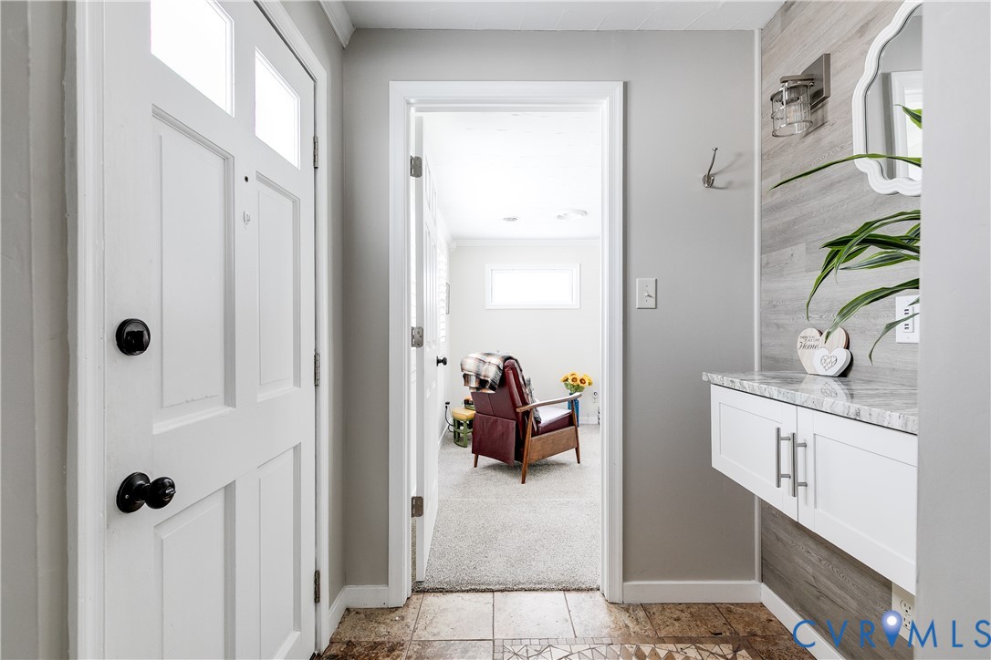 2815 Caniff Road Richmond, VA 23223 - Photo 19 of 39 a view of hallway with sink and wooden floor