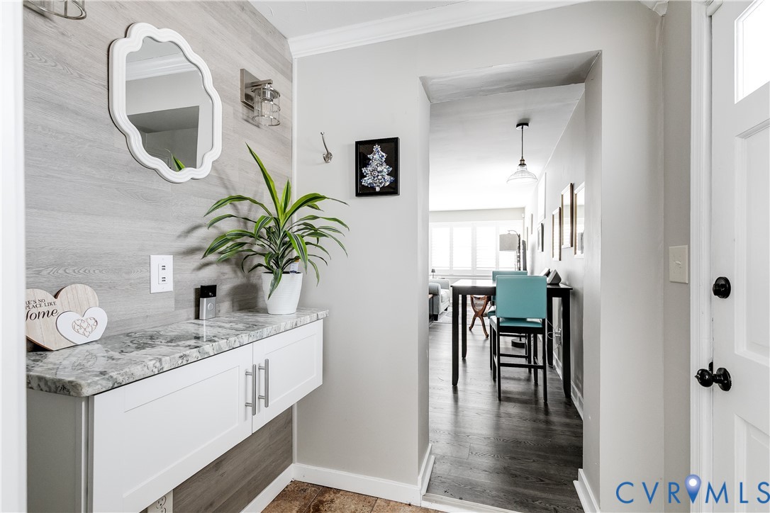 2815 Caniff Road Richmond, VA 23223 - Photo 20 of 39 a bathroom with a granite countertop sink a mirror and vanity