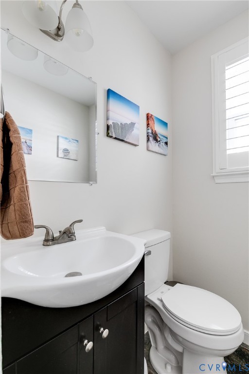 2815 Caniff Road Richmond, VA 23223 - Photo 26 of 39 a bathroom with a sink a toilet and a mirror