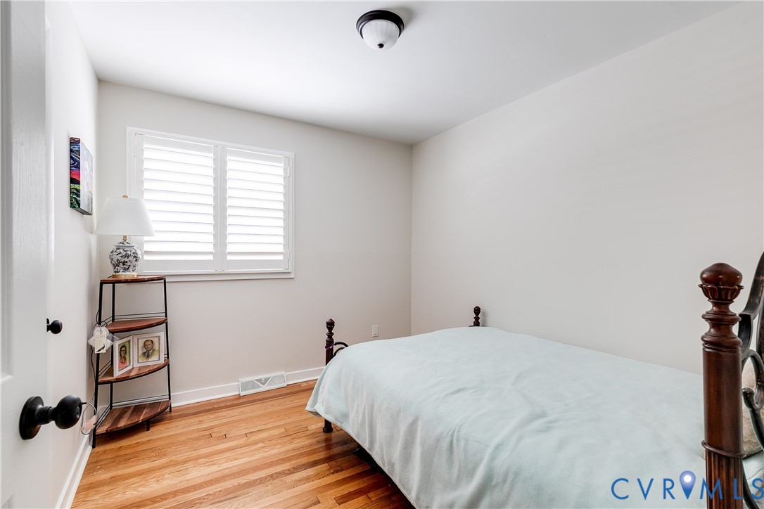 2815 Caniff Road Richmond, VA 23223 - Photo 32 of 39 a bedroom with a bed and a window