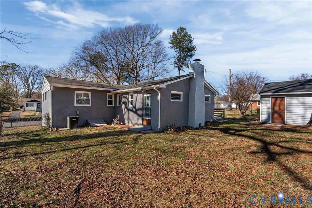 2815 Caniff Road Richmond, VA 23223 - Photo 4 of 39 a view of a house with a yard and garage
