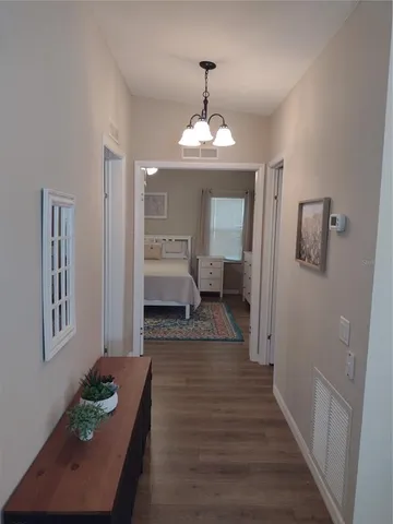 a bathroom with a granite countertop toilet sink and mirror