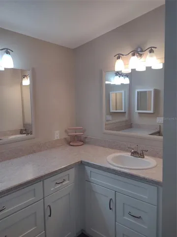 a white toilet sitting next to a bath tub