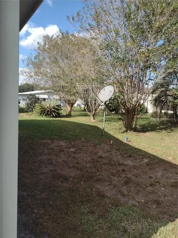 a kitchen with refrigerator cabinets and wooden floor