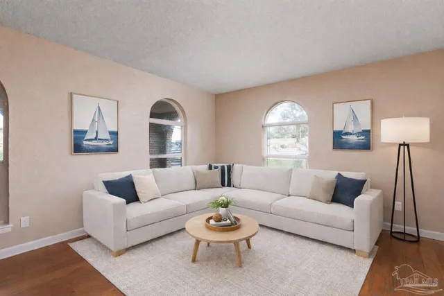 a living room with furniture and a large window