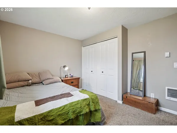 a bedroom with a bed and a cabinets