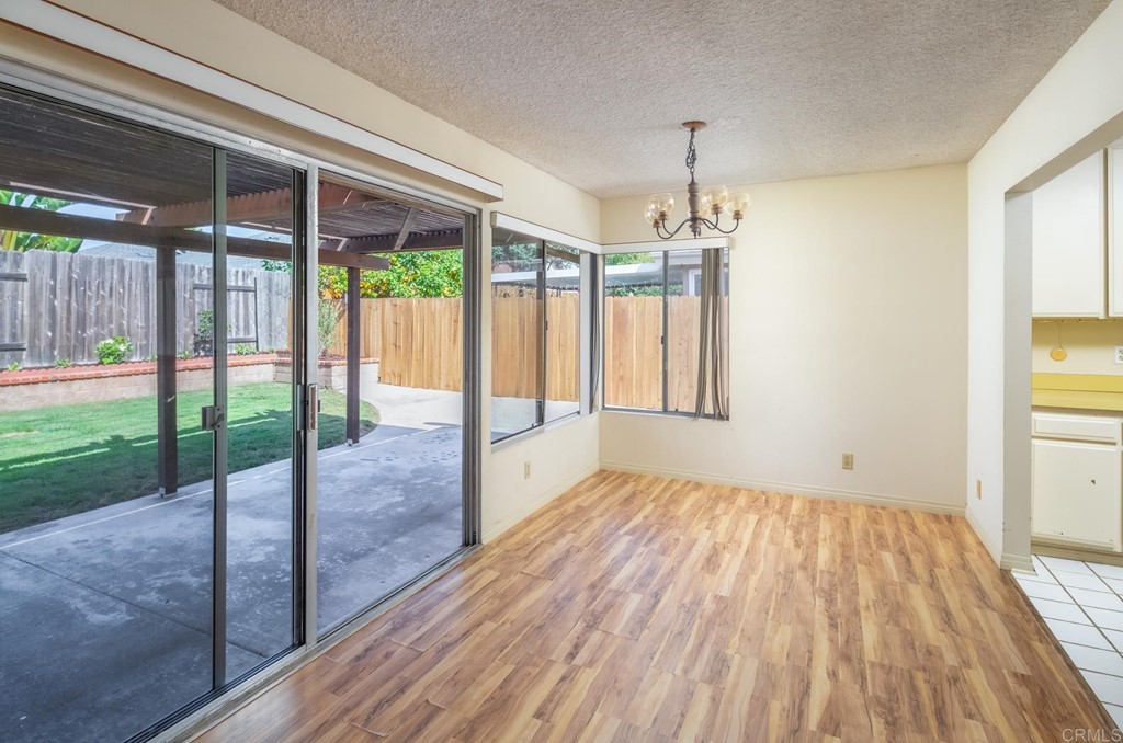 141 Solace Court Encinitas, CA 92024 - Photo 12 of 19 a view of empty room with wooden floor and fan