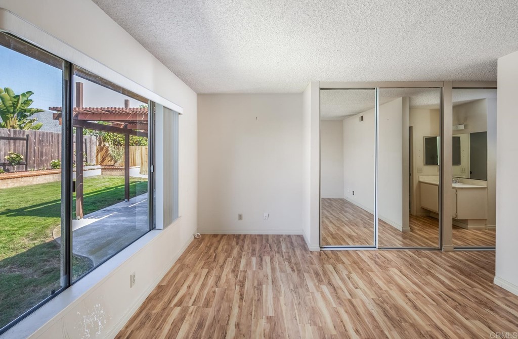 141 Solace Court Encinitas, CA 92024 - Photo 13 of 19 wooden floor in an empty room with a window