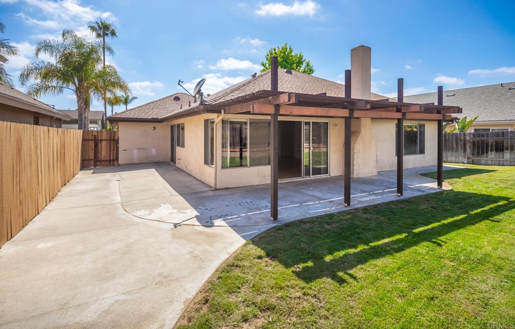 141 Solace Court Encinitas, CA 92024 - Photo 18 of 19 a view of a house with a yard and potted plants