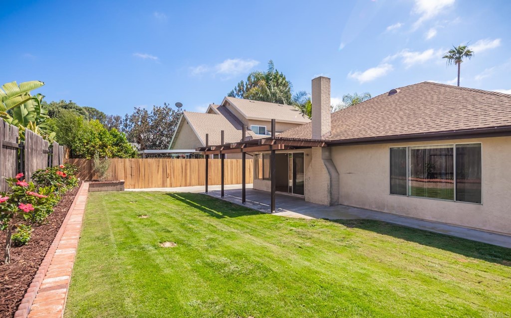 141 Solace Court Encinitas, CA 92024 - Photo 3 of 19 a view of a house with backyard and garden