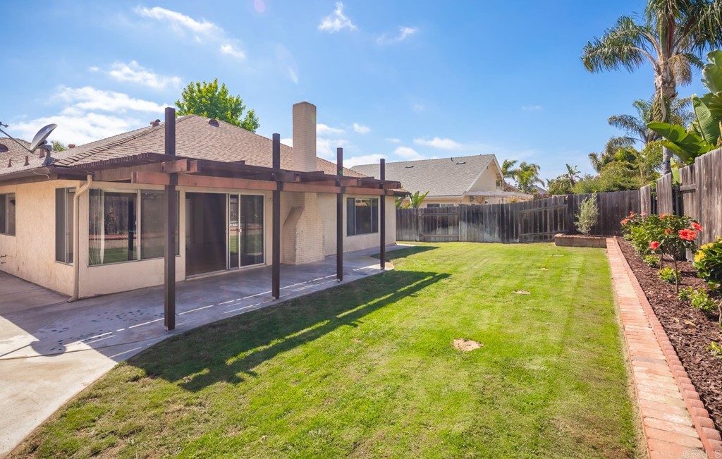 141 Solace Court Encinitas, CA 92024 - Photo 6 of 19 a swimming pool with outdoor seating and yard