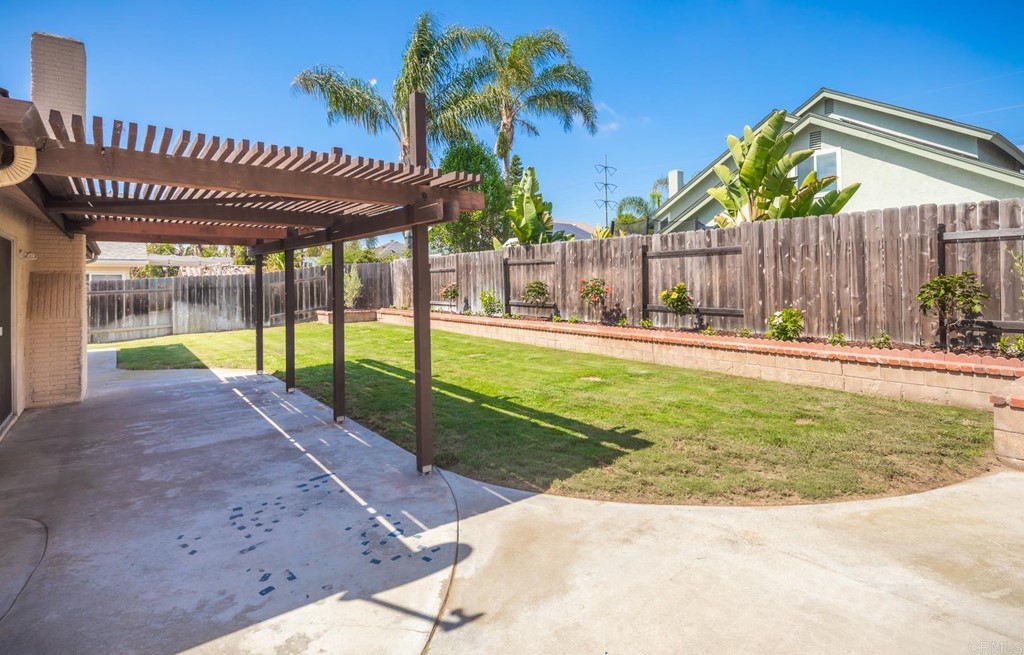 141 Solace Court Encinitas, CA 92024 - Photo 7 of 19 a swimming pool with wooden fence
