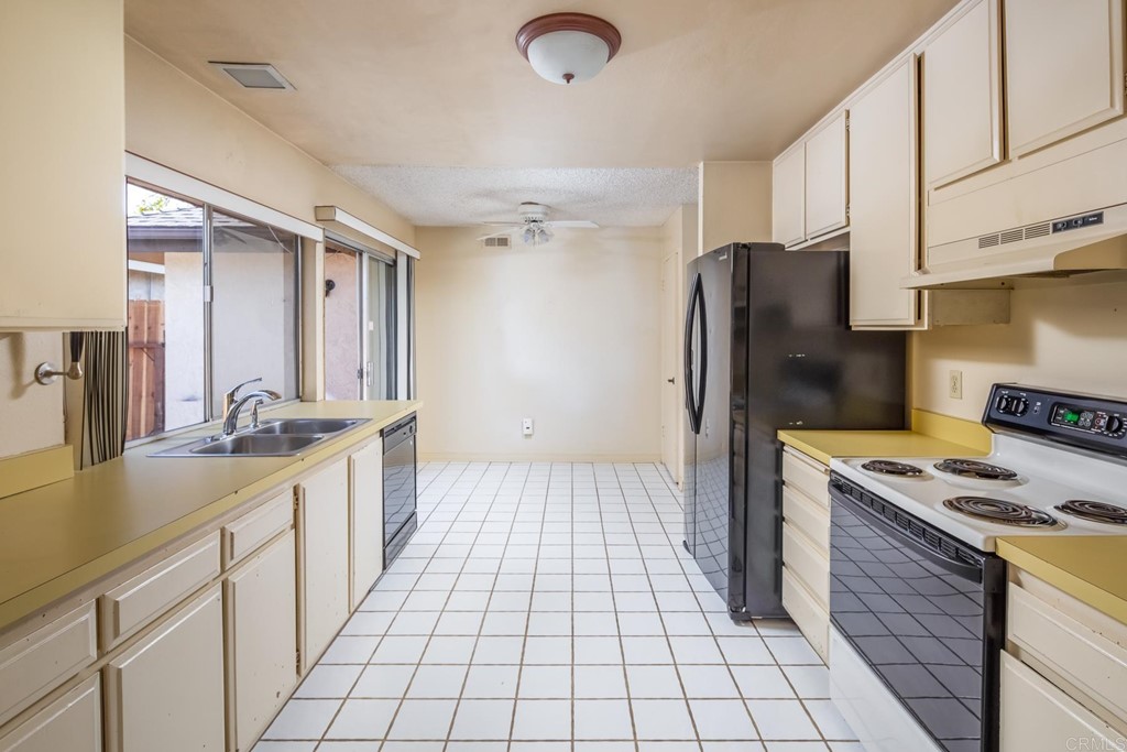 141 Solace Court Encinitas, CA 92024 - Photo 10 of 19 a kitchen with a sink appliances and cabinets