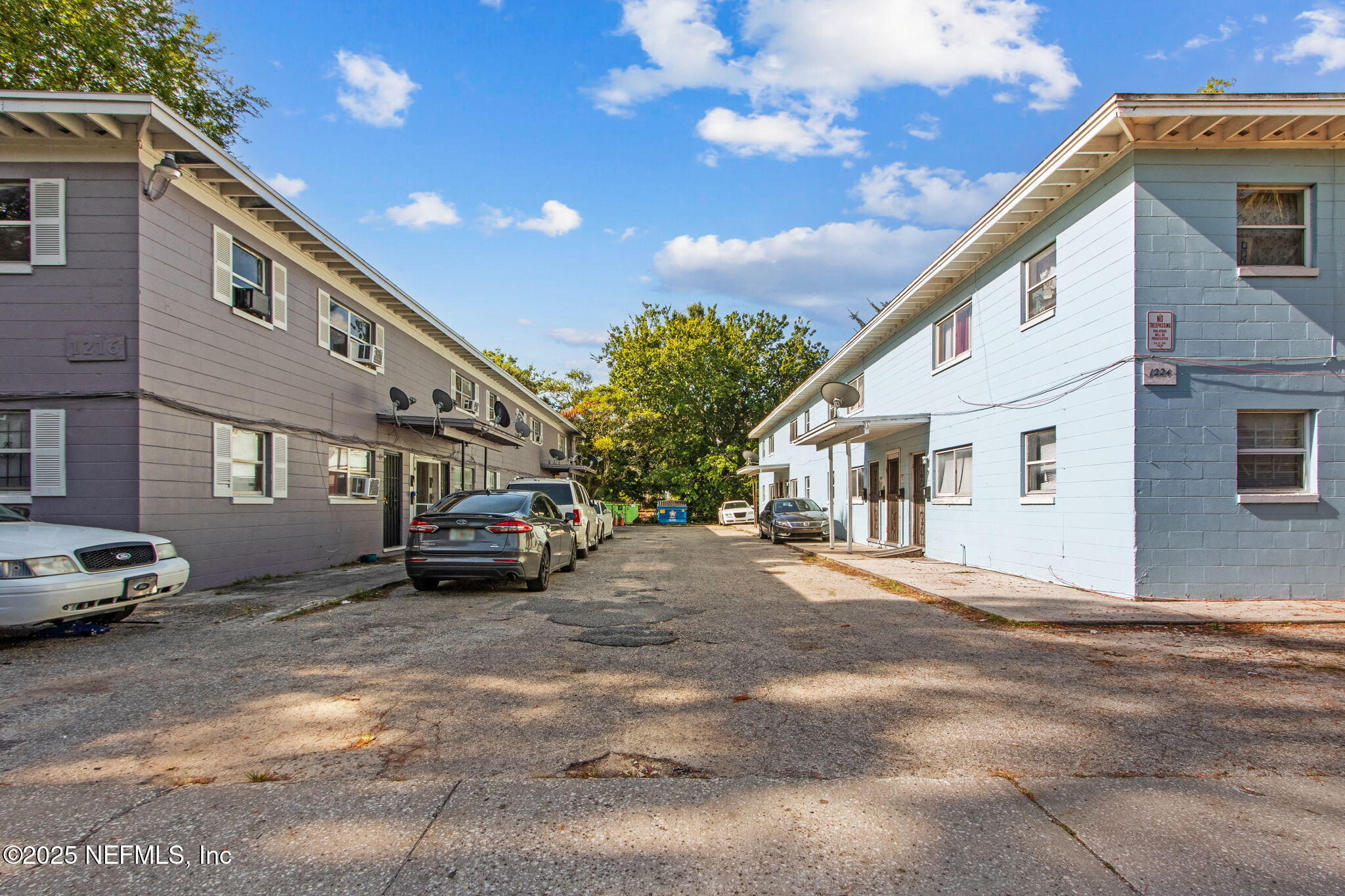 1224 West 18th Street, Unit 4 Jacksonville, FL 32209 - Photo 2 of 14 a car parked in front of a white building