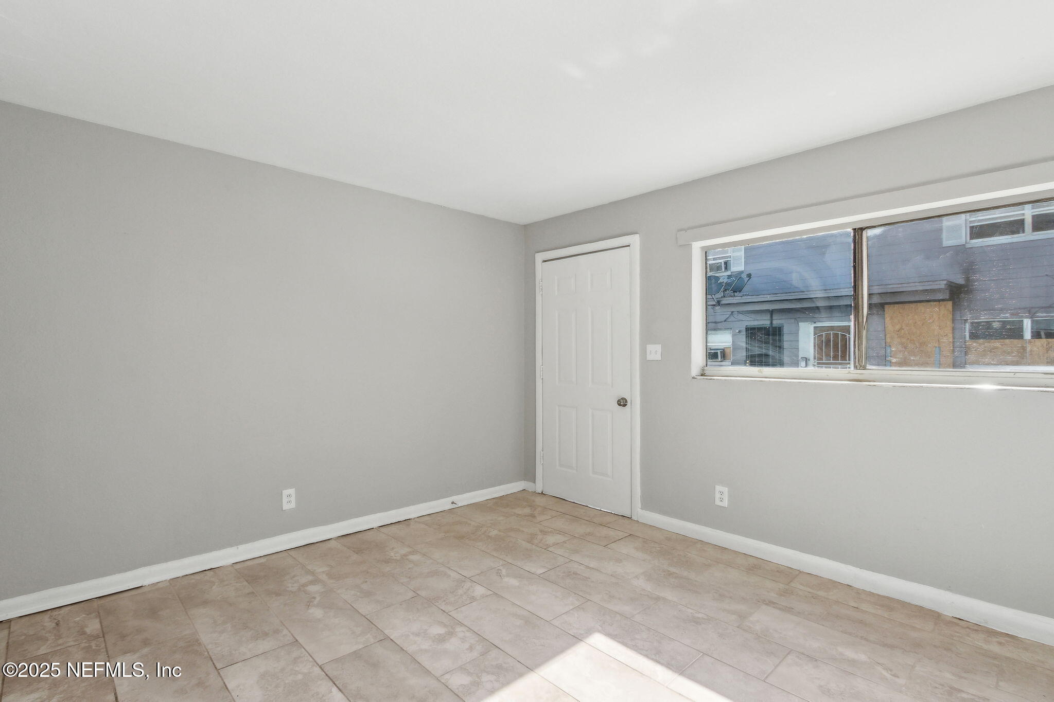1224 West 18th Street, Unit 4 Jacksonville, FL 32209 - Photo 4 of 14 a view of an empty room with a window