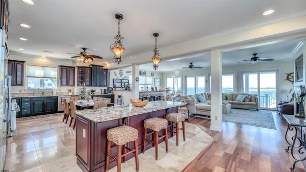 a large kitchen with a table and chairs