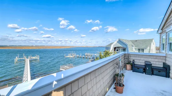 a view of roof deck with furniture