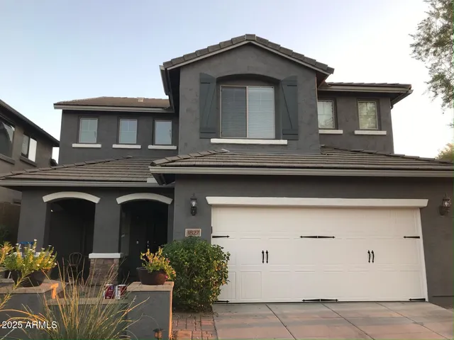 a living room with furniture a rug and a window