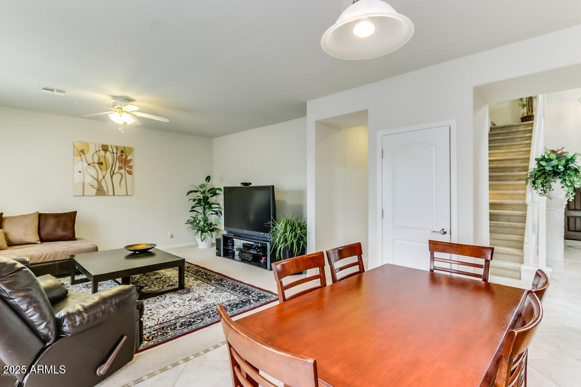 1827 West Black Hill Road Phoenix, AZ 85085 - Photo 15 of 49 a living room with furniture and a flat screen tv