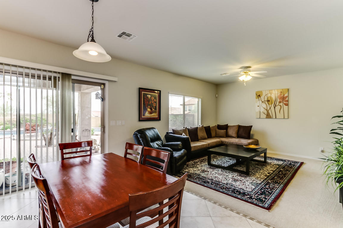 1827 West Black Hill Road Phoenix, AZ 85085 - Photo 16 of 49 a living room with furniture and a table