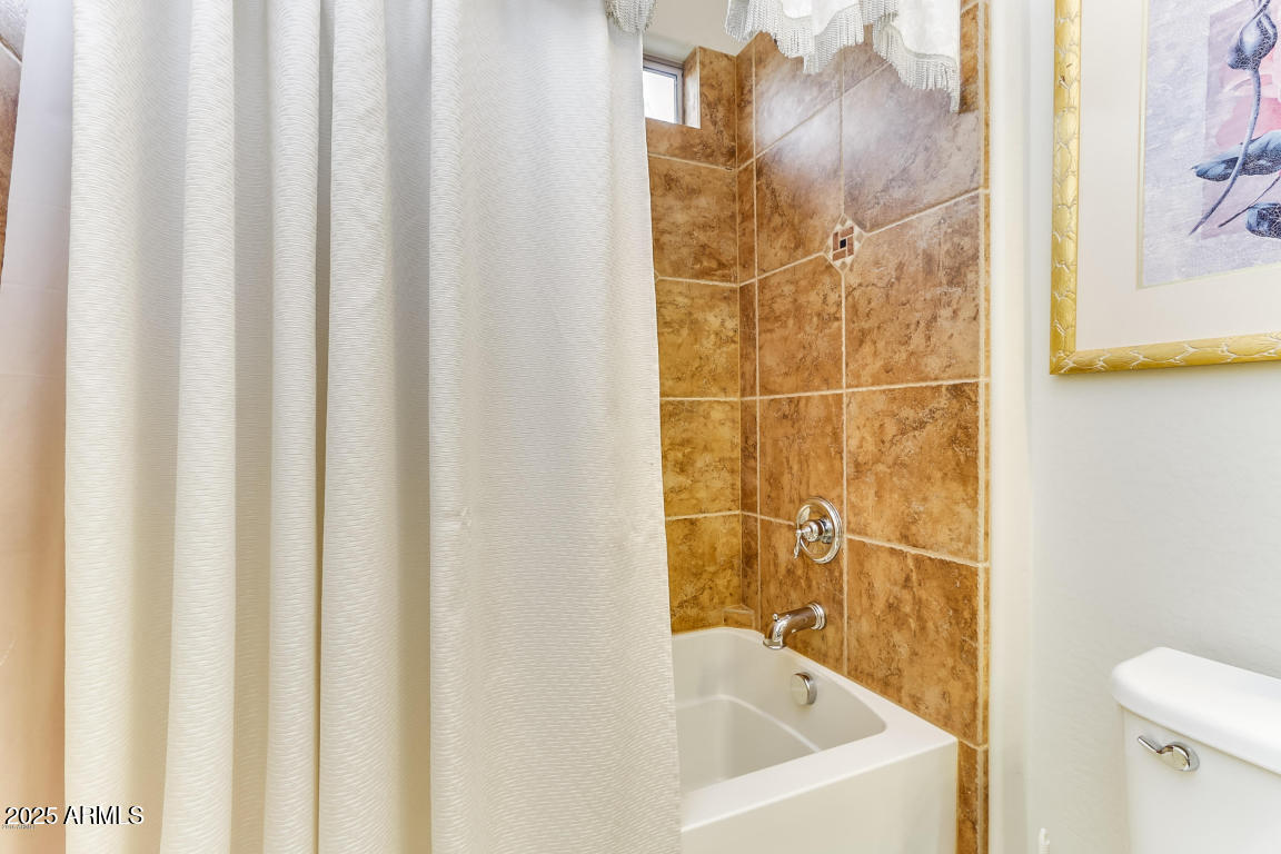1827 West Black Hill Road Phoenix, AZ 85085 - Photo 29 of 49 a bathroom with a bathtub