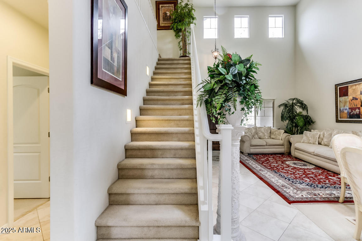 1827 West Black Hill Road Phoenix, AZ 85085 - Photo 30 of 49 a living room with furniture and a potted plant
