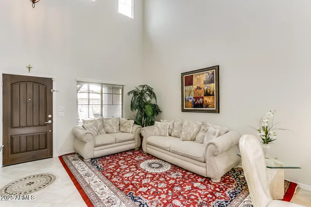 a living room with furniture and a rug